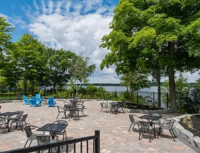 a group of tables and chairs in a patio at The Magnolia - 37 Butternut in Cherry Valley