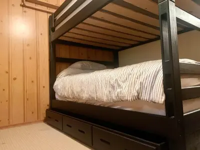 a bunk bed in a room with a bunk bed at Rustic and Spacious Lakefront Oasis in Nature in Algonquin Highlands