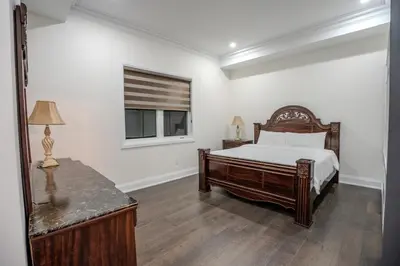 a bedroom with a bed and a window at Perfect Group Getaway Large House with Style in Bolton