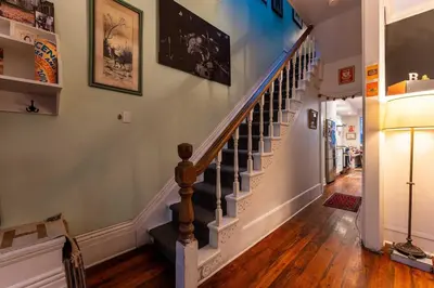 a staircase in a home with wooden floors at Spacious 3 Bedroom Toronto Home with Piano in Toronto