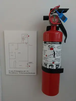 a fire hydrant with a pair of scissors on top at Private Suite With Private Entrance - Entire Place in Toronto