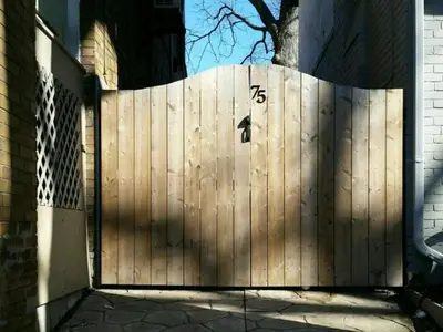 a wooden fence with the number on it at Private Suite With Private Entrance - Entire Place in Toronto