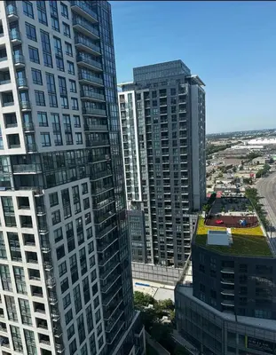 an aerial view of tall buildings in a city at Modern 1 bedroom with private bathroom near Toronto airport in Toronto