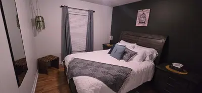 a bedroom with a bed with pillows on it at Paradise Haven in Arthur