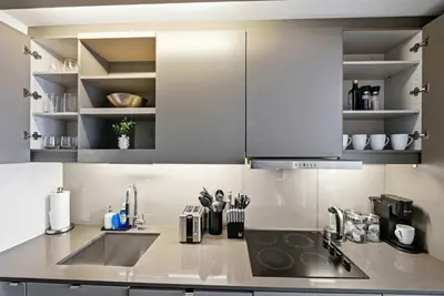 a kitchen with stainless steel cabinets and a sink at Heart of the City 1BR Condo Walk Everywhere in Toronto