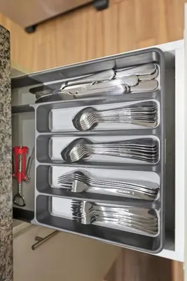 a drawer filled with silver utensils in a kitchen at Cozy 1BR Condo w Private Patio for Morning Coffee in Toronto