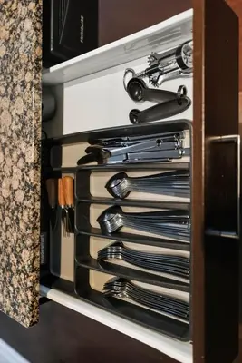 a drawer full of utensils in a kitchen at Designer Bay Street Condo Sleep 6 in Toronto