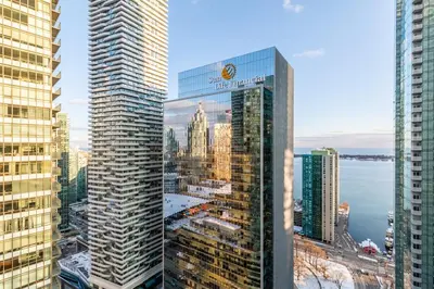 a view of a city from a skyscraper at Modern Studio Condo High Floor Downtown Toronto in Toronto