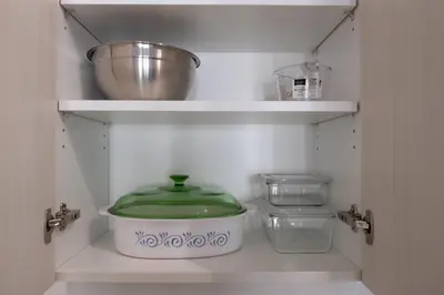 a shelf with a pot and a bowl in a kitchen at Propercare - The Wellingtons in Kitchener