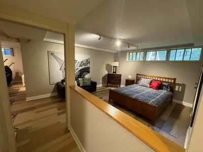 a bedroom with a bed and a large window at Spacious 4-Bedrooms Friendly House Toronto-Parking in Markham
