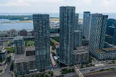 an aerial view of a city with tall buildings at Skyline Stays Chic 2BR Steps from Everything in Toronto