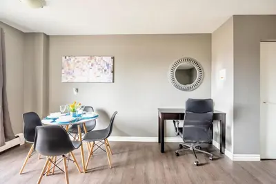 a dining room with a table and chairs at Charming Newly Renovated Condo - Glenview West in Hamilton