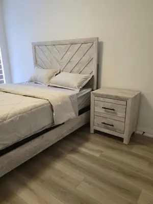 a bedroom with a large bed and a night stand at Modern 3BR FriendlyTown Home in Paris