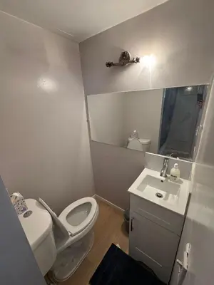 a small bathroom with a toilet and a sink at Private Room Near Airport D89 in Mississauga