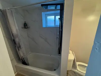 a bathroom with a shower with a glass door at Private Room Near Airport D89 in Mississauga