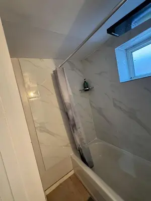 a bathroom with a shower with a shower curtain at Private Room Near Airport D90 in Mississauga