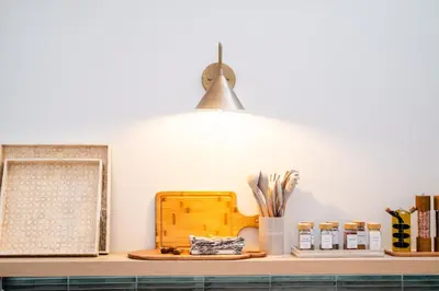 a kitchen counter with a shelf and a light at 'MoonBeam' Boho-Luxe Glamping Dome at Marmora Retreat in Marmora