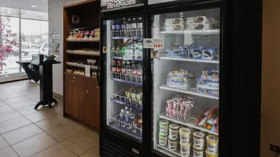 a refrigerator filled with lots of food and drinks at Holiday Inn Hotel Peterborough Waterfront by IHG in Peterborough