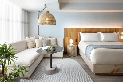 a bedroom with a bed and a couch at 1 Hotel Toronto in Toronto