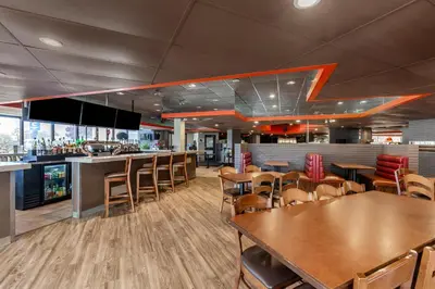 a restaurant with tables and chairs and a bar at Comfort Inn Airport West in Mississauga