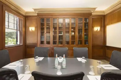 a conference room with a large table and chairs at Spencer Hotel & Conference Centre in London