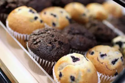 a tray of blueberry muffins in at Holiday Inn Express Whitby Oshawa by IHG in Whitby