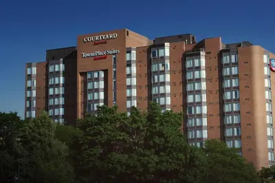 a tall red brick building with a sign on it at TownePlace Suites by Marriott Toronto Northeast/Markham in Markham