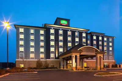 a hotel building with a clock on top of it at Courtyard by Marriott London in London