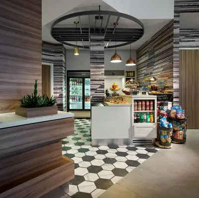 a fast food restaurant with a checkered floor at Hilton Garden Inn Toronto Airport in Mississauga