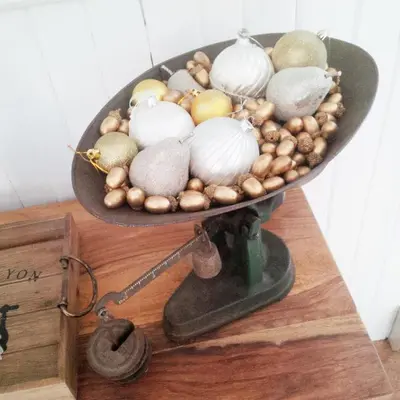 a bowl of shells on a scale on a table at Picturesque School House Retreat in Meaford