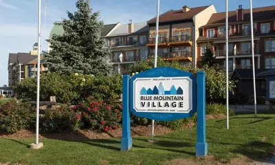 a sign for a ridge mountain village in front of a building at Beautiful Mountain Studio in The Blue Mountains in Blue Mountains