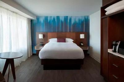 a hotel room with a bed and a table at Toronto Marriott City Centre Hotel in Toronto