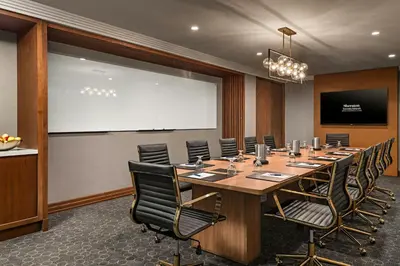a conference room with a large table and chairs at Sheraton Toronto Airport Hotel & Conference Centre in Toronto