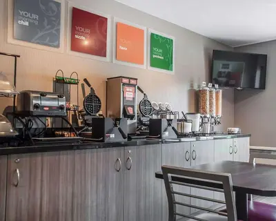 a fast food restaurant with a counter with a table at Comfort Inn in Simcoe