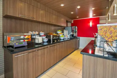 a kitchen with a counter with food on it at Comfort Inn in Newmarket