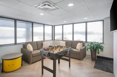 an office with a table with a game on it at Comfort Inn in Belleville