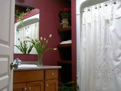 a bathroom with a sink and a mirror at Antique Slumber Old Town Bed & Breakfast in Niagara on the Lake