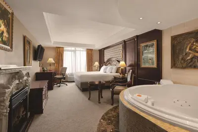 a hotel room with a bed and a bath tub at Radisson Hotel Toronto Airport West in Mississauga