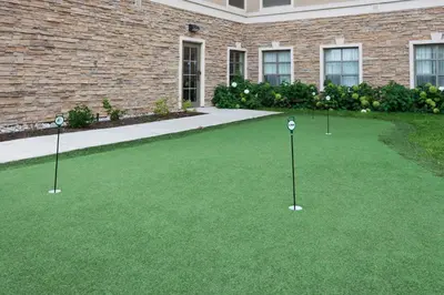a golf course with three putts in the grass at Staybridge Suites Guelph by IHG in Guelph