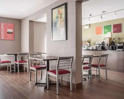 a dining room with a table and chairs at Comfort Inn in Orillia