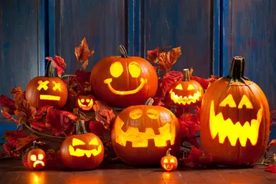 a group of halloween pumpkins sitting on a table at Holiday Inn Toronto Airport East by IHG in Toronto