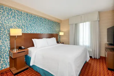 a hotel room with a bed and a television at Fairfield Inn & Suites by Marriott Toronto Airport in Mississauga