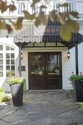 a lobby of a building with a sign over the door at Windermere House in Windermere