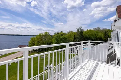 a balcony of a house with a view of the water at Windermere House in Windermere