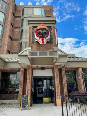 a building with a clock on the front of it at Ramada Plaza by Wyndham Niagara Falls in Niagara Falls