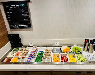 a buffet line with many different types of food at Holiday Inn Burlington Conference Centre by IHG in Burlington