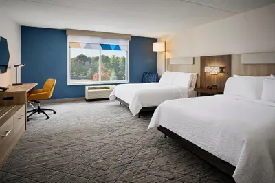a hotel room with two beds and a window at Holiday Inn Express & Suites Kitchener Southeast by IHG in Kitchener