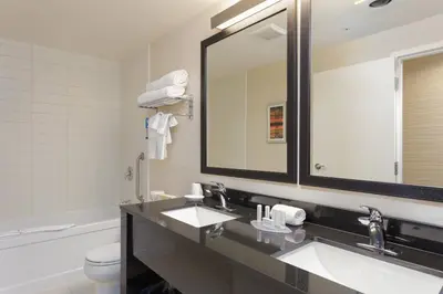 a bathroom with two sinks and a large mirror at Fairfield Inn & Suites by Marriott Belleville in Belleville
