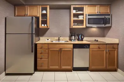 a kitchen with a refrigerator and a sink at Residence Inn by Marriott London Canada in London