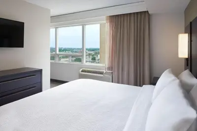 a hotel room with a bed and a window at Residence Inn by Marriott London Canada in London